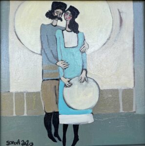"Stay With Me" is a painting in which a man and a woman stand together. The woman holds a drum in her hand, and the man holds the woman in his arms.